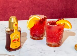 Meli Cranberry–Sinaasappel Spritz met Honing